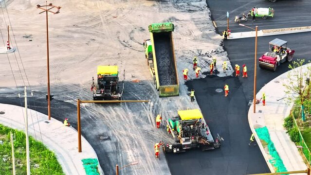 Aerial pan shot of road construction site scene