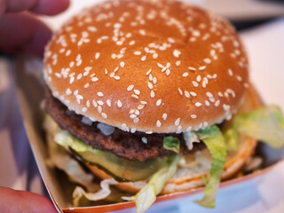 Classic Fast Food Double Burger with Sesame and Lettuce Close-Up