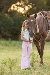 Little Girls with Horses riding western quarter horse and paint horse cowgirls in pink having fun