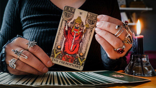 Malmö, Sweden - April 1, 2024: The Hierophant Major Arcana Tarot Card Rider Waite Smith. Spiritual altar, Divination tool, witchcraft, healing crystals, fortune telling cards, cartomancy.
