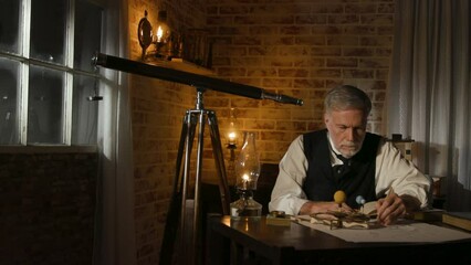 victorian astronomer looks at an orrery to predict the next eclipse