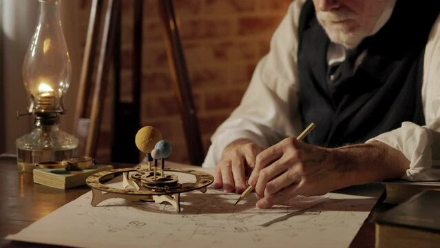 Victorian era astronomer using an orrery to predict a eclipse