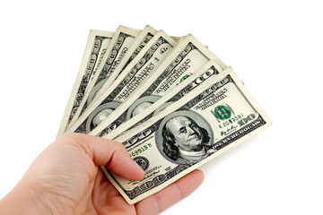 A pack of dollar bills in his hand on a white background
