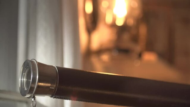 rack focus from oil lamp to vintage telescope
