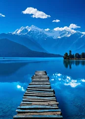 Poster Rara Lake is the largest lake in Nepal, known for its crystal-clear waters, surrounded by lush forests and snow-capped mountains. © suman