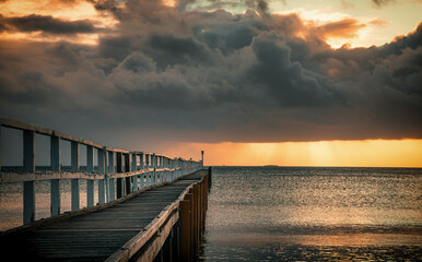 The view of the ocean and Sorrento Long Pier under the sunbeam in Mornington Peninsula in Melbourne at dawn 