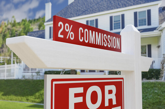 2% Commission For Sale Real Estate Sign In Front Of New House.