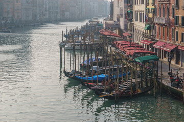 Gondolas on Grand Canal in front of building facades seen from Rialto bridge, Venice, Veneto, Italy