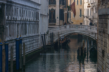 Fototapeta na wymiar Small canal passing towards famous Bridge Ponte de Canonica, Venice, Veneto, Italy