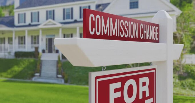 Commission Change For Sale Real Estate Sign with a New Home in the Background.

