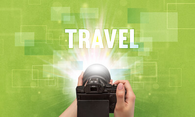 hand holding digital camera, traveling concept