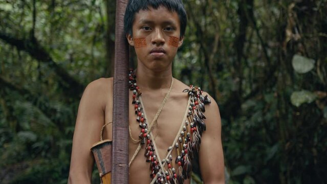 Body of a Huaoranis young Man carrying a Blowgun and darts