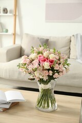 Beautiful bouquet of fresh flowers in vase on wooden table indoors - obrazy, fototapety, plakaty