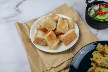 Sliced Toast bread white plate on vintage background.. Continental Breakfast concept. 