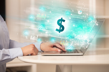 Young man watching stock market on laptop