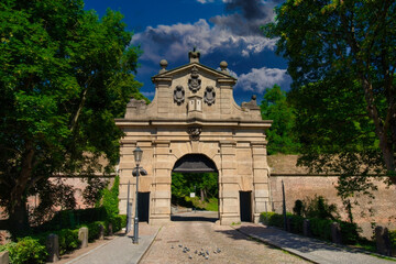 Stone Gate with Classical Coat of Arms, Bathed in Sunlight, in Prague City
