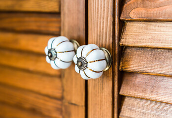 two wooden door handles close up