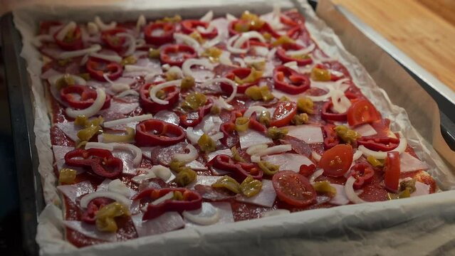 Topping homemade pizza with fresh ingredients, Genthin, Germany, Europe
