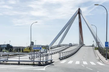 Cercles muraux Atlantic Ocean Road A small bridge for road traffic and pedestrians with a suspension structure with metal stays