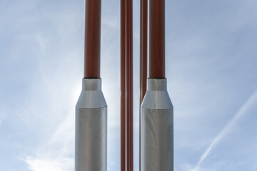 metal suspenders of a small bridge for road traffic and pedestrians