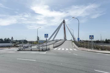Crédence de cuisine en verre imprimé Atlantic Ocean Road Image of the metal structure of a small bridge for road traffic and pedestrians, with indicative road traffic signage on a day with a bright sky