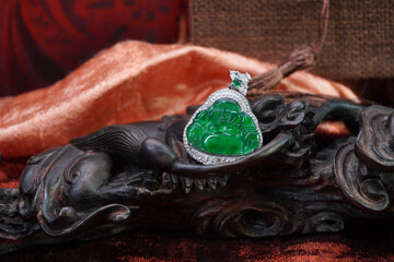 Imperial green jadeite jade Smiling Buddha pendant. Beautiful Chinese style jewelry © Cheattha