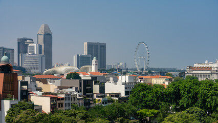 High-rise buildings at Central Business District (CBD) in Singapore with Singapore Flyer at daytime.