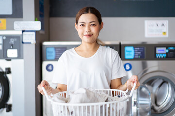 Woman at self service laundry store.