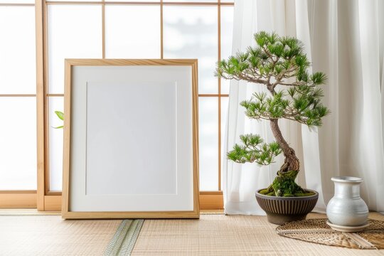 A bonsai tree is displayed in a rectangular frame in the room