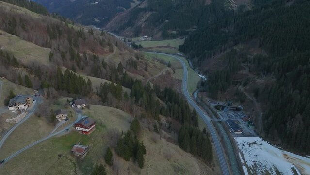 Twilight descends on Saalbach-Hinterglemm (Austria) with a scenic aerial view of the resort and surrounding nature