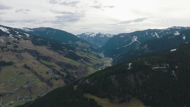 Saalbach-Hinterglemm (Austria) ski resort with snowy mountains and valleys, aerial view