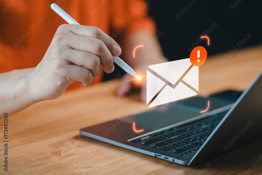 Poster Man multitasks with a pen and laptop, A cautionary email alert notification symbolizes the importance of security measures against errors, ensuring internet protection amidst concerns like junk mail.