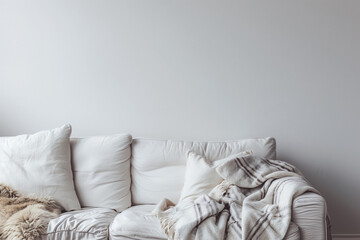 Scandinavian, hygge interior design of modern living room, home. White sofa with fur plaid against blank wall with copy space. - obrazy, fototapety, plakaty