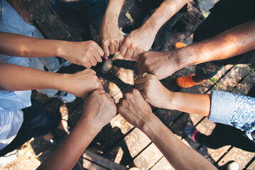 Diverse multiethnic Partners hands together teamwork group of multiracial people meeting join hands togetherness. Diversity people hands join empower partnership teams connection volunteer community - obrazy, fototapety, plakaty