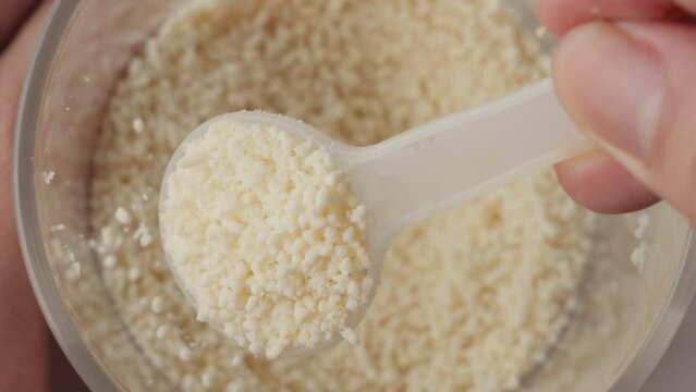Plastic Spoonful Take Up Powdered Mushroom Seasoning Blend Msg From Container, Top Down View