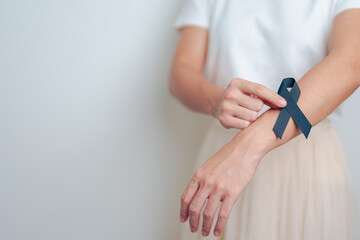 Melanoma and skin cancer, Vaccine injury awareness month and rest in peace concepts. woman holding...