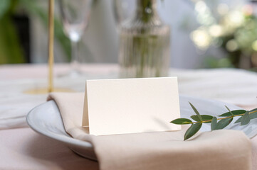 Mockup white blank space card, for Name place, Folded, greeting, invitation on wedding table...
