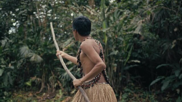 Man paddling in a Canoe in Amazon