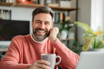 Caucasian man is holding a cup of coffee or tea in the morning at home before starting work