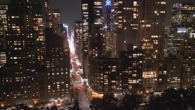 NYC, Manhattan at Night city lights. Night in Manhattan, NYC aerial view. New York City, Illuminated NYC view from drone. NYC, Manhattan skyline. Night city scene NY, USA.