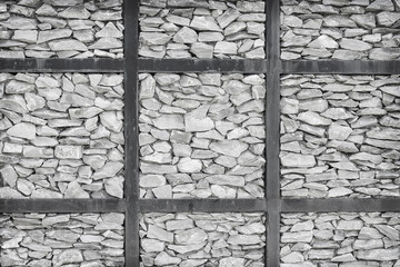 Grey stone fence wall texture background in steel structure