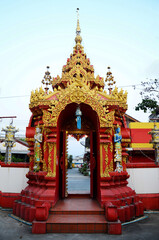 Ancient gate entrance of antique temple in Wat Ming Mueang temple for thai people travelers travel visit and respect praying blessing holy buddha worship on February 24, 2015 in Chiang Rai, Thailand