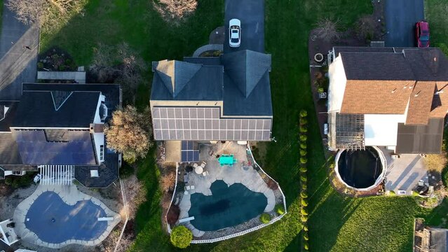 Luxury homes in USA with private swimming pool. Modern noble urban houses in American Suburb. Aerial top down shot.