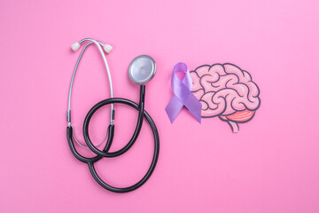 Epilepsy Awareness Day. Purple Ribbon on Brain Paper Cutout and Stethoscope on Pink Background