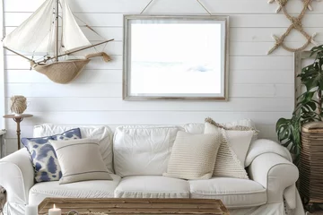  White couch in a living room with sailboat wall decor © yuchen