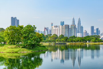 Kuala Lumpur skyline. Scenic lake in a city park - 772726667