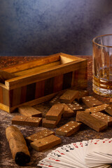dominoes with tobacco cigarette, poker and whiskey