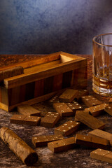 dominoes with tobacco cigarette and whiskey