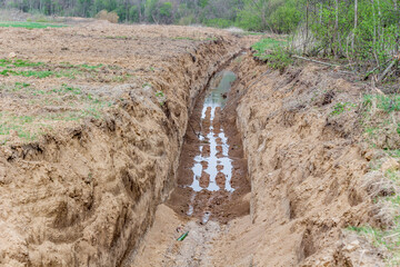 Dug in the ground a big trench