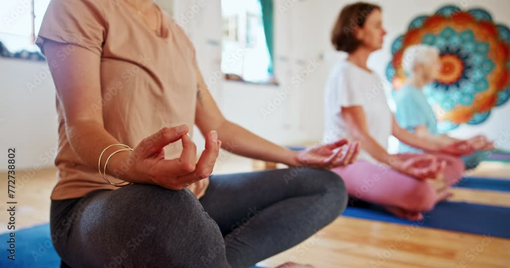 Wall mural Woman, hands and meditation with yoga class for spiritual wellness, breathing or inner peace. Closeup of female person or yogi meditating in lotus for health. awareness or chakra together on mat